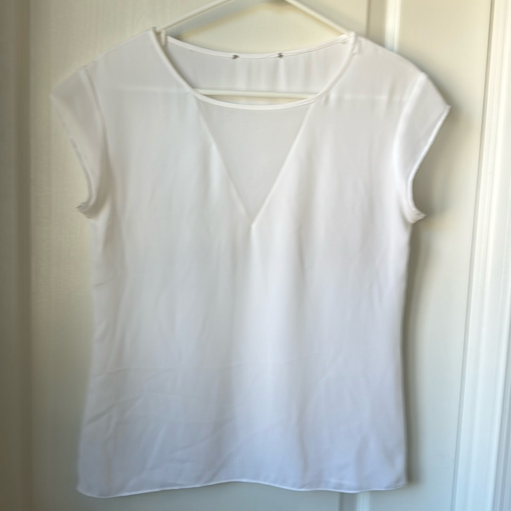Nameless women top in white, most likely small